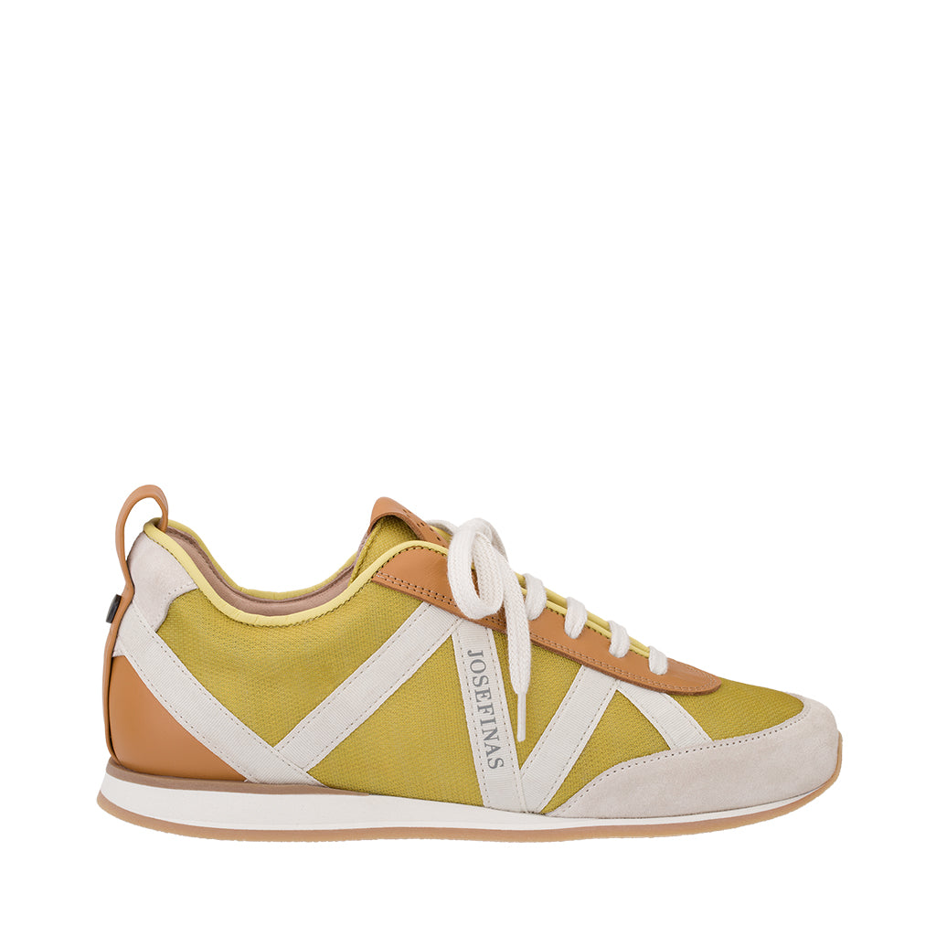 Yellow and white athletic sneaker with a tan sole
