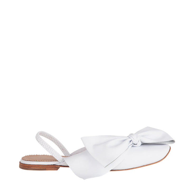 White slingback flats with a large bow detail on the front