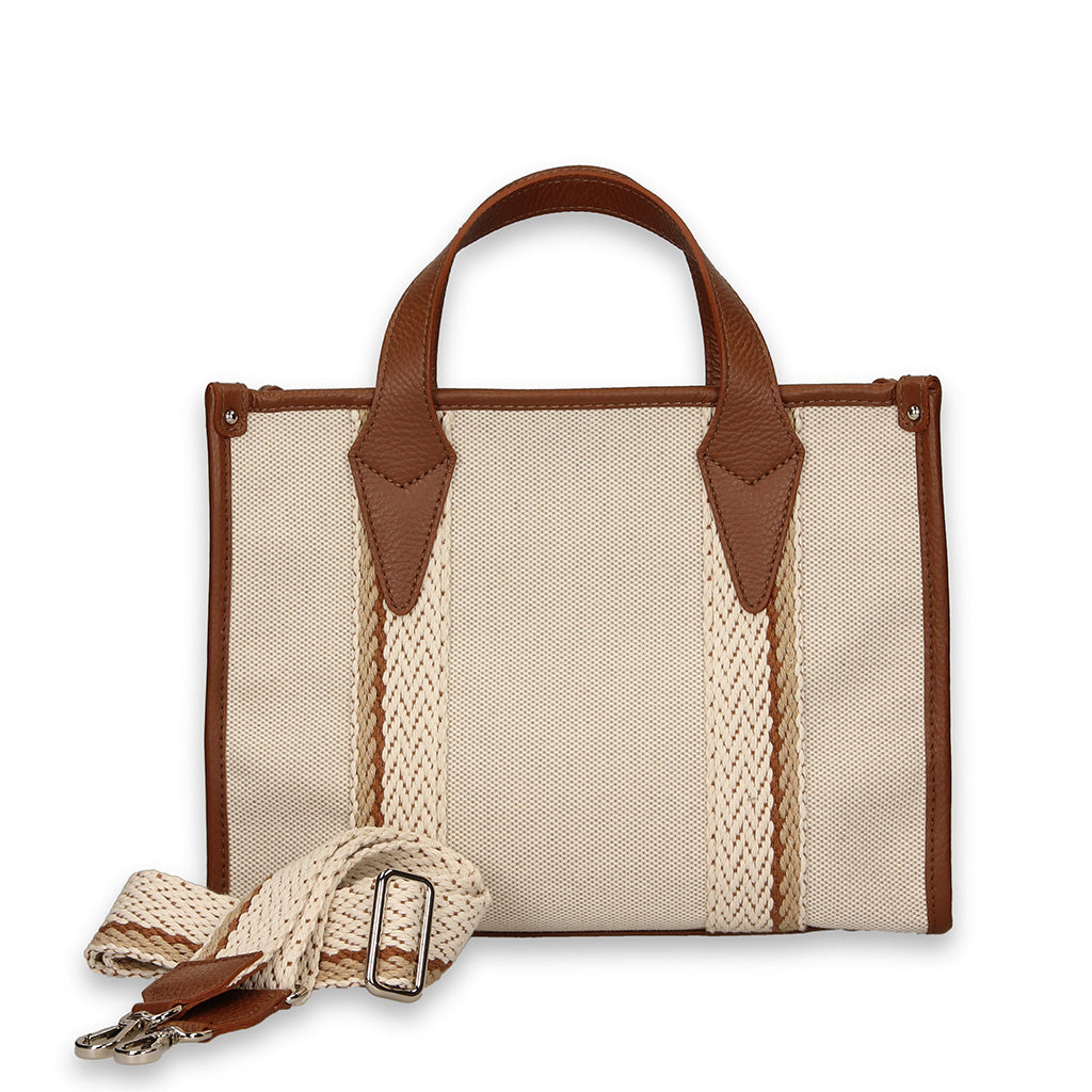 Beige canvas handbag with brown leather accents and an adjustable strap