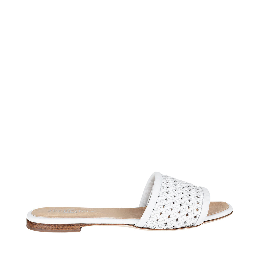 Flat white woven slide sandal with open toe and minimalist design