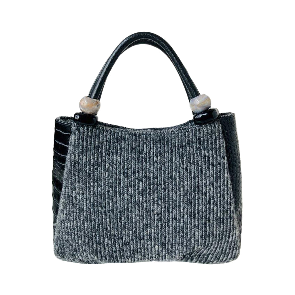 Black and grey woven handbag with leather handles