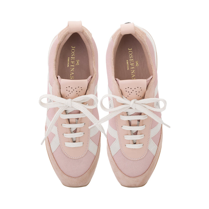 Pink and white sneakers from Josefinas with white laces and gold branding on insoles