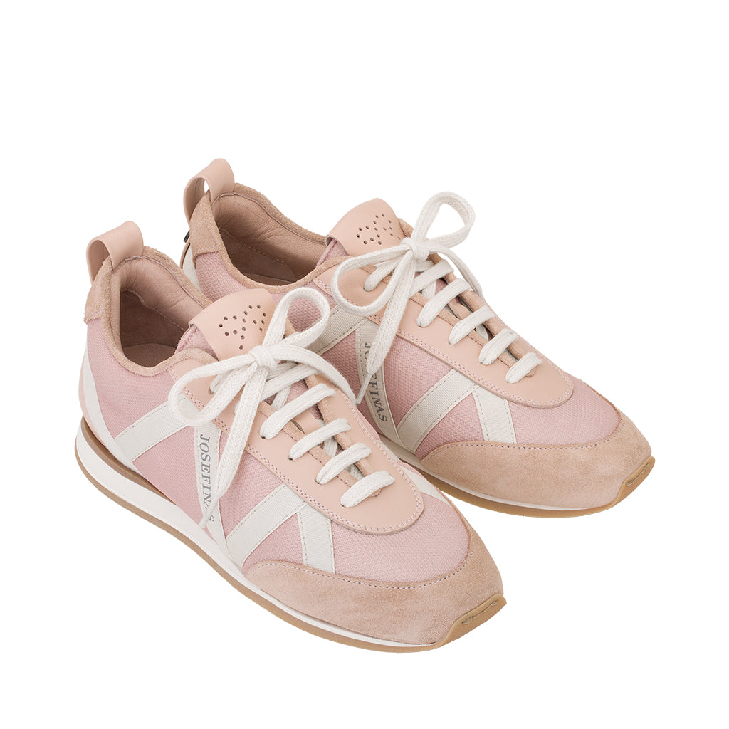 Pink and white women's athletic sneakers with laces and branded logo