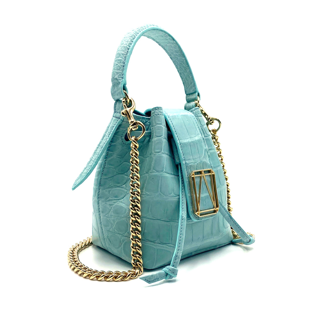 Light blue crocodile leather handbag with gold chain strap and clasp
