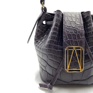 Elegant black crocodile leather handbag with gold accent