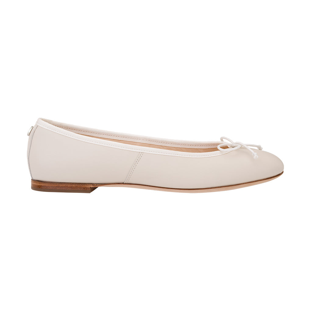 White leather ballet flat with bow detail and wooden sole