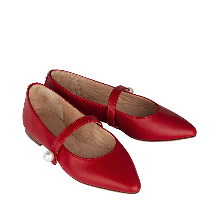 Red leather Mary Jane flats with pearl embellishments
