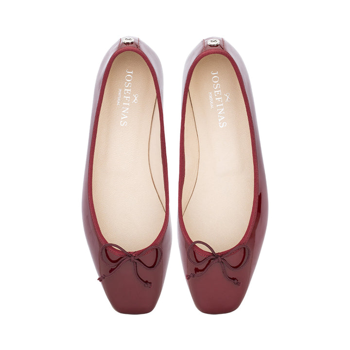 Red ballet flats with bow detail on toe box
