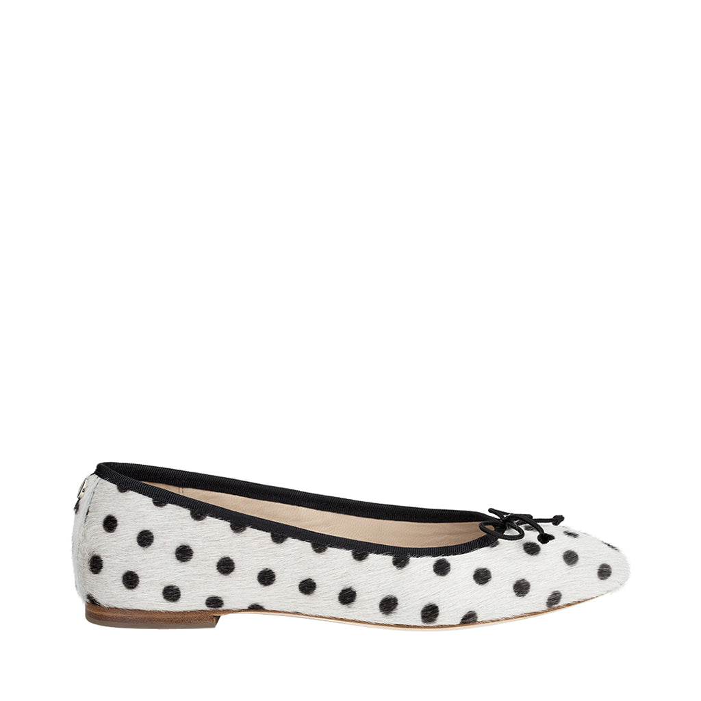 Stylish white ballet flat with black polka dots and bow detail